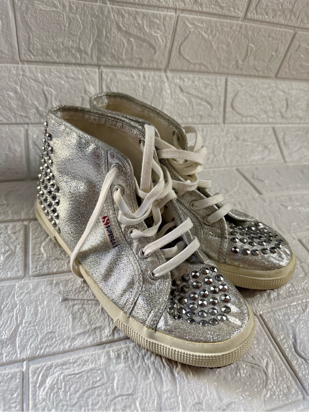 Metallic Silver High-Top Sneakers with Rhinestone Toe